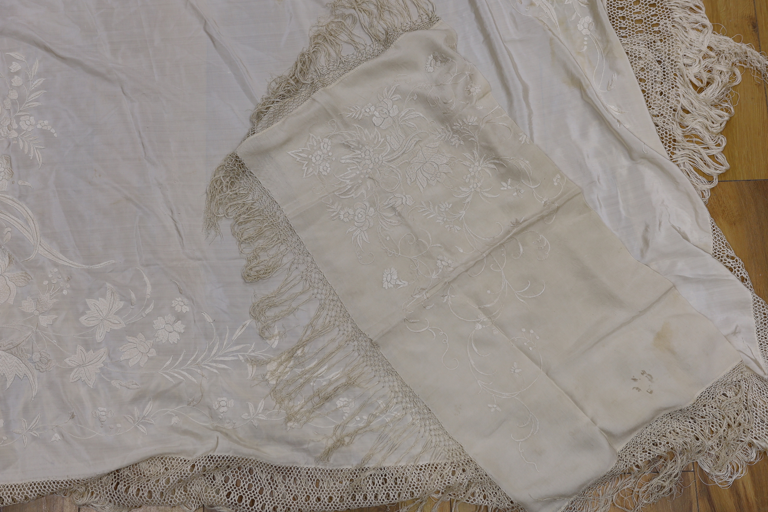 Two silk cream on cream Chinese embroidered shawls